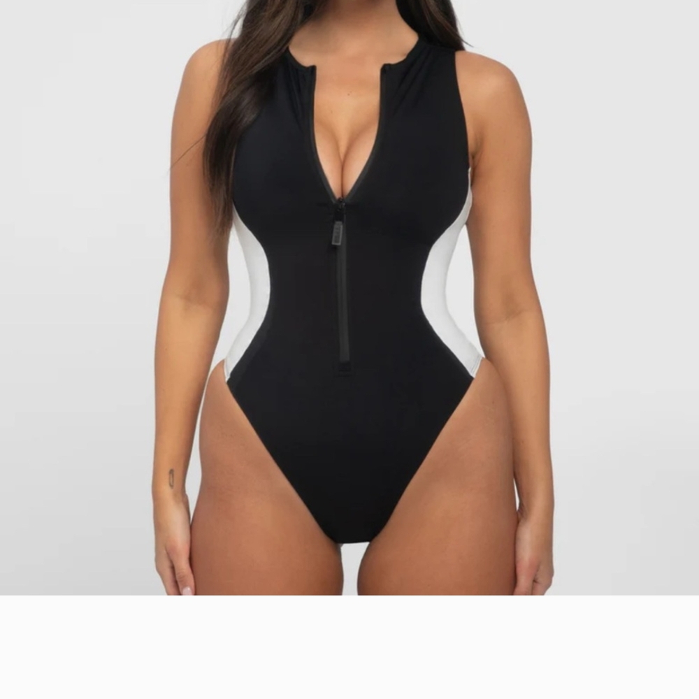 Sleek Black and White One-Piece Swimsuit with High-Leg Cut